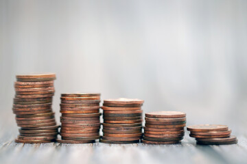 Savings, increasing columns of gold coins coin stack growing money stairs business and financial concept