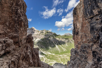 Fototapeta na wymiar Pass through the cliffs of the Dolomites Alps. Summer, beautiful sunny day