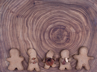 Fototapeta na wymiar rustic brown gingerbread cookies on wooden table