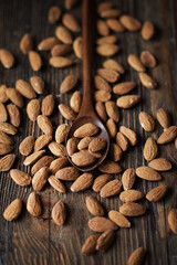 almonds on a brown wooden background