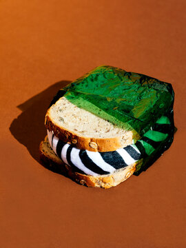 Sandwich in green plastic wrap