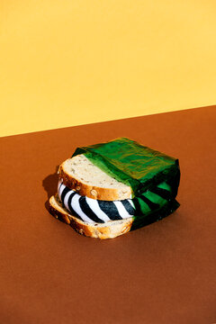 Sandwich in green plastic wrap