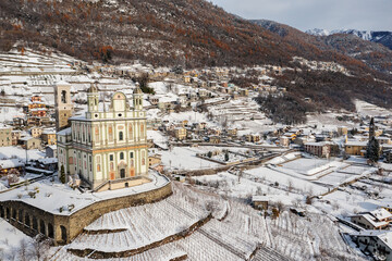 Fototapeta premium aerial view of the village of Tresivio in Valtellina, Italy, Church of Santa Maria di Loreto