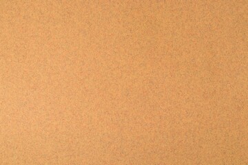 Background texture of beige paper with splashes of colored fibers. Copy space