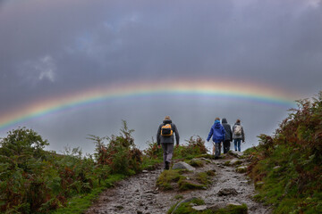 Family walking into a rainbow