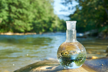 Flask with clear river water.