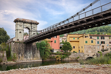 Fototapeta na wymiar Bagni di Lucca, Tuscany. Italy: the Bridge of Chains, 19th-century suspension bridge over the river Lima that links Fornoli and Chifenti villages