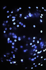 Defocused background in trendy very beri color. Blurred texture of glitter paper. 