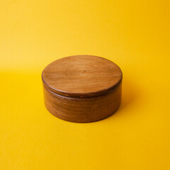 wooden jewelry box with yellow background