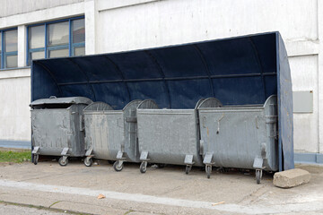 Fototapeta na wymiar Dumpster Bins Covered Place