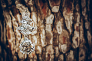 A jewel hung on a tree bark background