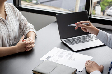 Reviewing the resume of applicants who are interviewing for an accounting position at a company, HR managers reviewing applicants' resumes, job interview ideas and recruiting.