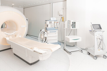 Medical CT or MRI Scan in the modern hospital laboratory. Interior of radiography department. Technologically advanced equipment in white room. Magnetic resonance diagnostics machine.