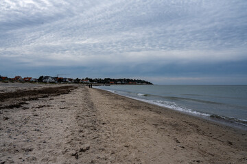 Fototapeta na wymiar A beautiful dark winter sky over a beach. Picture from Gilleleje, Denmark