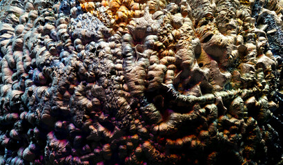 3d render of abstract art 3d background texture with part of rough grunge planet asteroid surface with damages scratches cranks and crater holes in stone iron material in yellow and purple color