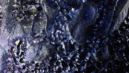 Naklejka premium 3d render of abstract art 3d background texture with part of rough grunge planet asteroid surface with damages scratches cranks and crater holes in metal iron material in blue violet color