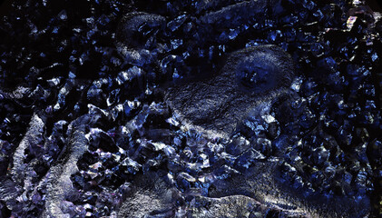 3d render of abstract art 3d background texture with part of rough grunge planet asteroid surface with damages scratches cranks and crater holes in metal iron material in blue violet color