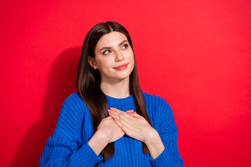 Photo portrait brunette in casual pullover looking copyspace thankful sincere isolated vibrant red color background