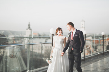 Beautiful luxury bride on the balcony with perfect landscape