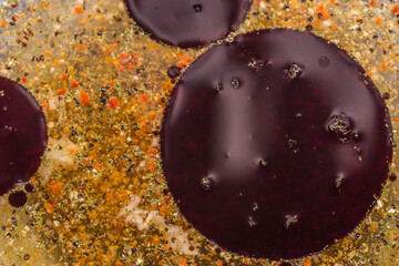 many brownish rings of fat from pumpkin seed oil in a salad dressing