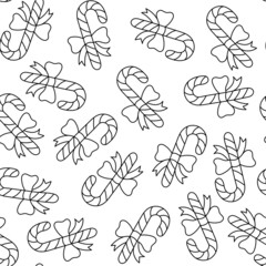 Hand-drawn vector doodle-style pattern with Christmas cane candy with a bow.