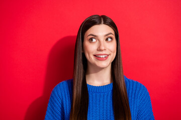 Photo portrait brunette wearing blue sweater looking blank space interested wondering isolated on...