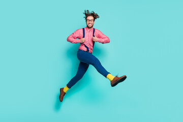 Fototapeta na wymiar Full size profile side photo of young excited man happy positive smile jump isolated over turquoise color background