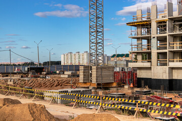 Modern construction site. Start of construction of a monolithic high-rise building. Construction industry and technologies.