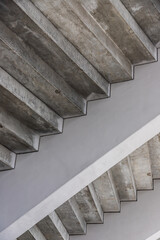 Grey concrete staircase in modern contemporary minimalistic interior