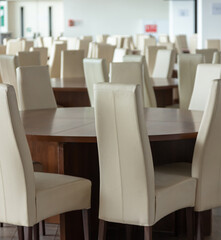 Abstract modern interior of cafe or meeting room with rounded armchairs