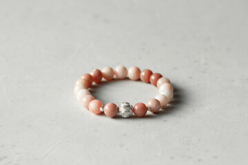 Pink opal bracelet. A bracelet made of stones on a hand from natural stone Pink opal. Bracelet made...