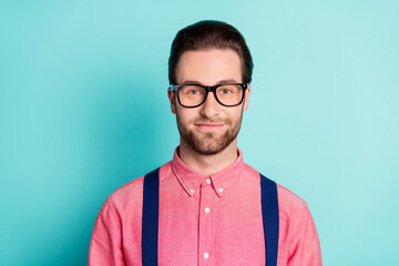 Photo of cheerful young happy man smile good mood wear glasses suspenders isolated on teal color background
