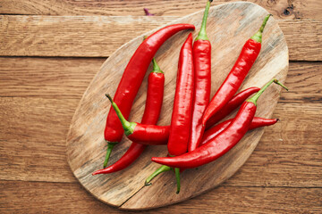 red hot chili peppers on a wooden board kitchen ingredients