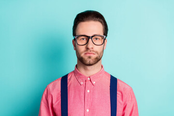 Photo of serious charming young man wear glasses serious face gentleman isolated on teal color background