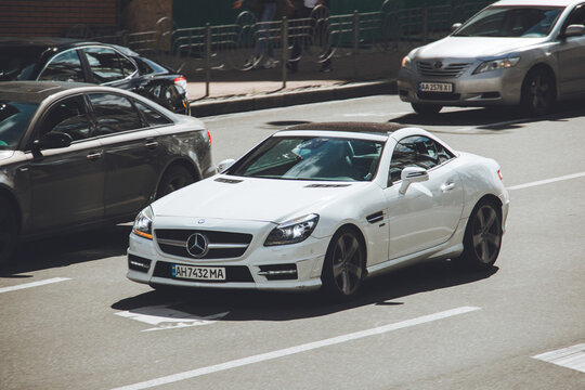 Kiev, Ukraine - June 12, 2021: White Mercedes-Benz SLK 250 on the road