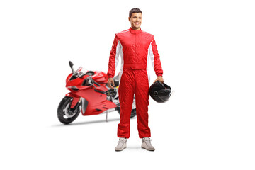 Full length portrait of a racer with a red motorbike holding a helmet