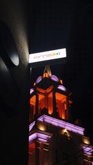 The night city in purple lights overlooking the tower