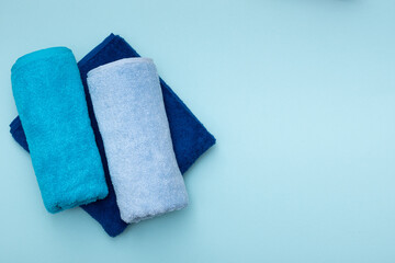 Composition of colored cotton towels. The concept of softness and purity