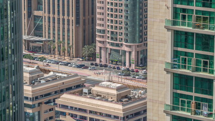 Skyscrapers and traffic on Sheikh Zayed Road and DIFC timelapse in Dubai, UAE.