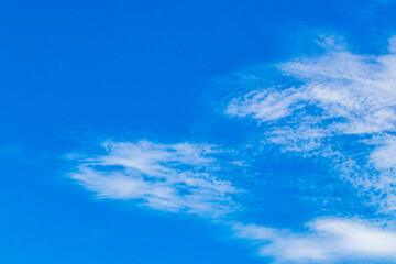 Naklejka na ściany i meble Blue sky with chemical clouds chemical sky chemtrails sunny day.