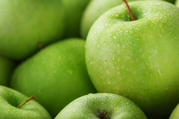 Juicy Green apple close-up with dew drops.