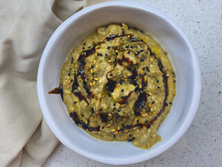 Middle Eastern cuisine-babaganush, eggplant caviar, from baked eggplant, garlic, tahini, lemon, olive oil, mint. Step-by-step recipe. Step 3.