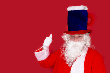 Comical Santa Claus in a hat in the shape of a beer mug, gesture very well, everything is fine, on...