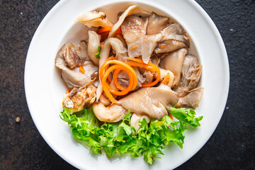 oyster mushrooms salad pickled mushrooms, carrots, Korean marinade healthy meal diet snack on the table copy space food background rustic. top view keto or paleo diet veggie vegan or vegetarian food