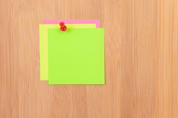 Colored Sticky Notes with Copyspace Pinned to the Wooden Message Board. To Do List Reminder in...