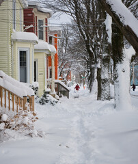 Halifax, Canada covered in snow after first snowstorm of season. Unplowed sidewalk, snow covered in...