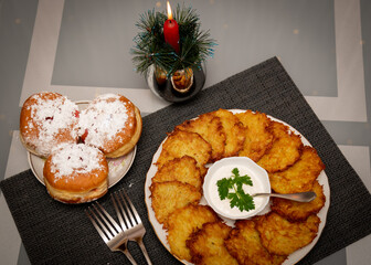 Traditional food on Hanukkah. Fried potatoes. Donuts.
