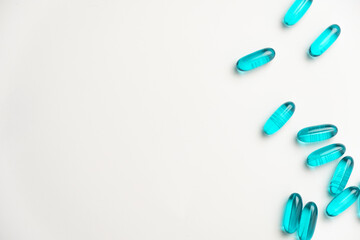 Blue pills isoalted on white background. Top view