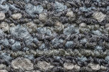 Seamless close up of monochrome grey carpet texture background from above..