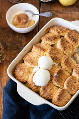 Apple cobbler with poppy seeds and ice cream